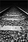 Railway tracks; black and white shot.