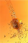 the orange under the juice splashes 3d rendering