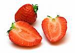 two halves and whole strawberries on white background