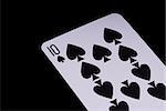 A poker card slanted view over black background