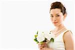 Portrait of Asian bride with bouquet.