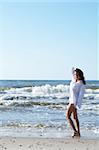 20-25 years old Beautiful Woman on the beach, wearing shirt