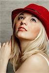 a blond women with a red hat