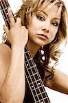 Latina blonde Girl sitting with bass guitar