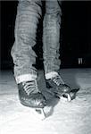 Female legs in jeans and skates