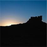 Silhouette of Garden of the Gods rock formation at dusk in Monument Valley, Utah.