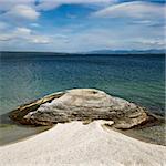 Geyser formation at water's edge in Yellowstone National Park, Wyoming.