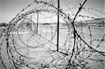 barbed wire at the border of a mine field
