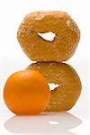 two glazed donuts with orange showing food choices