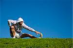 healthy lifestyle: man doing stretching in a park