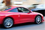 Speeding car. Scene from Sant Peterburg roadside. Special toned and motion-blur foto f/x, focus on car.