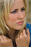 Close up portrait of a beautiful young woman deep in thought