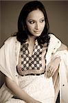 Portrait of an Indian woman wearing a dress with traditional Indian brocade embroidery