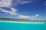 footbridge over turquoise ocean on an maldivian island