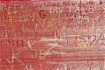 Abstract background of old wood surface with carved graffiti