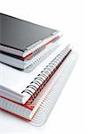 Some notebooks with soft shadow on white background. Shallow DOF