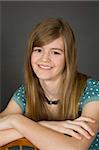 Preteen girl posing on gray background with some attitude