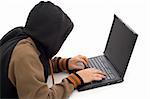 Hacker in the front of a laptop computer