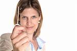 a young woman shows an old key