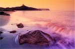 sunrise on a rocky shore in Sardinia, Italy