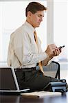 Business executive using his cell phone