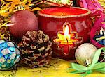 colorful christmas decorations with burning candle