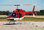 Red colored helicopter before takeoff