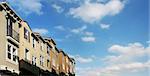 Modern houses and sky with clouds