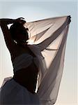 Woman silhouette with a scarf