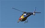 A TV news helicopter with a camera. A motion blur on rotor blades