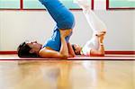 health club: women doing stretching and aerobics