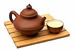 Teapot and teacup on a small wooden table