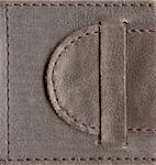 brown textured leather lock, belt stitched by thread over edges, high-resolution scan