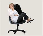 Businesswoman contemplating in her office chair