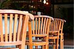 Row of wooden outdoor chairs in tropical style