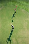 Aerial view of mid adult Caucasian man and woman being excited on golf course at Bald Head Island, North Carolina.