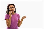 African American mid adult woman wearing glasses gesturing while talking on cell phone.
