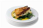 Chicken schnitzel, baked with potato mash, baby spinach and beure blanc sauce. Includes a clipping path to remove shadow or change background.