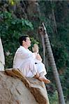 Man meditating in the forest