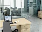 Laptop background is my own image. 3D rendering of an empty meeting room