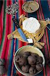Homemade cow cheese made by peruvian highlanders with potatoes clay dip