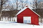 A winter cabin in winter scene