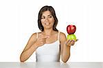 Beautiful young woman holding a green and a red apple