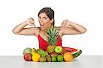 Beautiful hungry woman eating a lot of healhty fruits