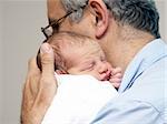 Father and a baby on the first day in the hospital