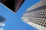Office and corporate buildings in perspective with bright blue sky.