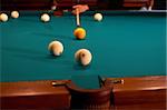 Balls and a cue on a billiard table - playing.