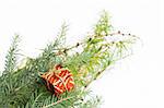 Christmas decoration made of green pine needles and small present