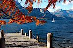 Small sailboat sailing in Como Lake, Italy