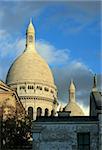 Sacre Coeur in Paris, France, as the sun begins to lower.